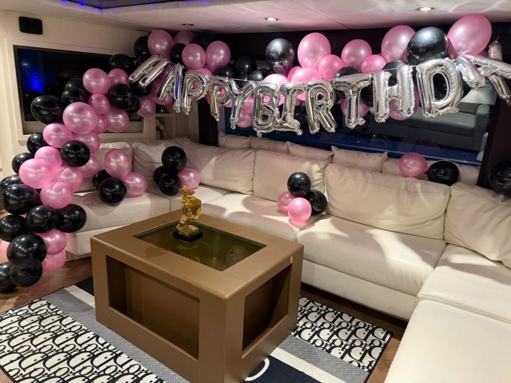 Happy Birthday balloon decoration in a yacht saloon in Dubai